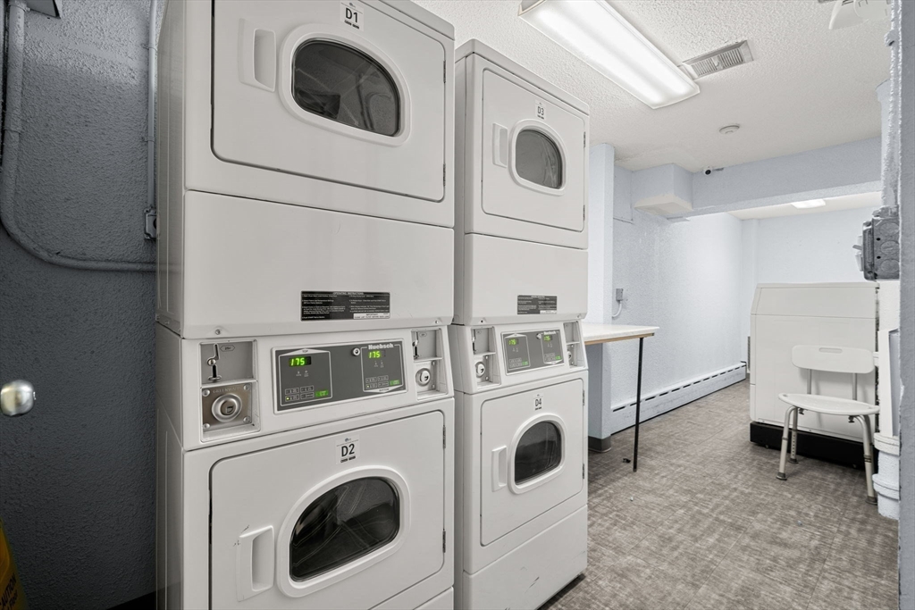 94 Beacon Street, Unit 83 Somerville, MA 02143 - Photo 16 of 22 a utility room with dryer and washer