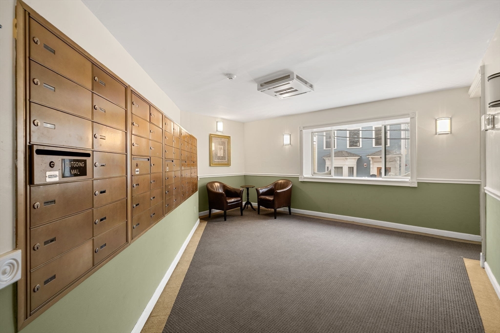 94 Beacon Street, Unit 83 Somerville, MA 02143 - Photo 18 of 22 a view of livingroom with furniture and windows