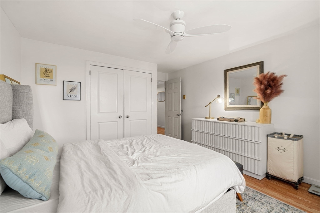 94 Beacon Street, Unit 83 Somerville, MA 02143 - Photo 10 of 22 a bedroom with a bed and a cabinets
