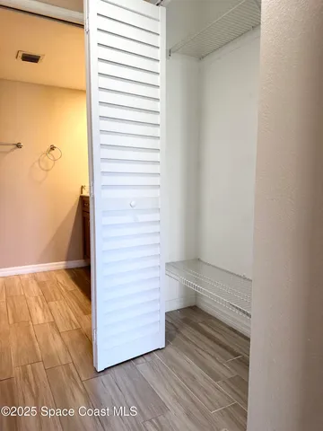 a view of a room with racks on the wall