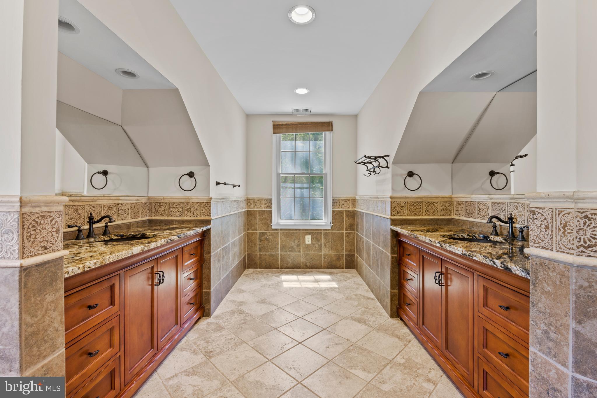 11019 Ring Road Reston, VA 20190 - Photo 33 of 78 a kitchen with stainless steel appliances granite countertop a stove a sink and a refrigerator