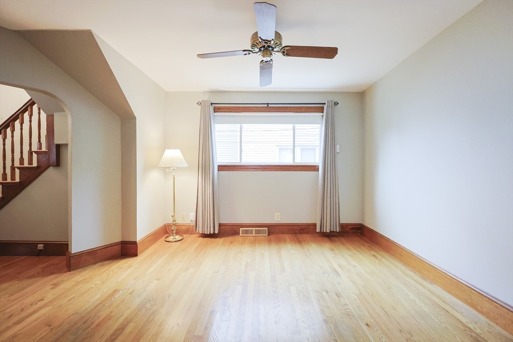 580 2nd Street Everett, MA 02149 - Photo 13 of 29 a view of empty room with wooden floor and fan