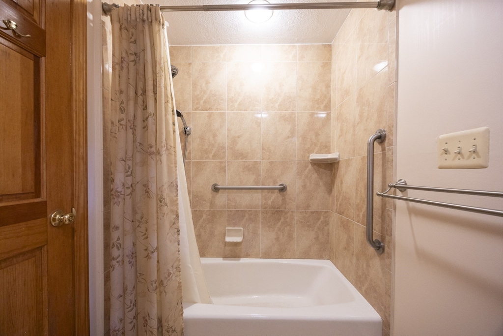 580 2nd Street Everett, MA 02149 - Photo 14 of 29 a bathroom with a bathtub