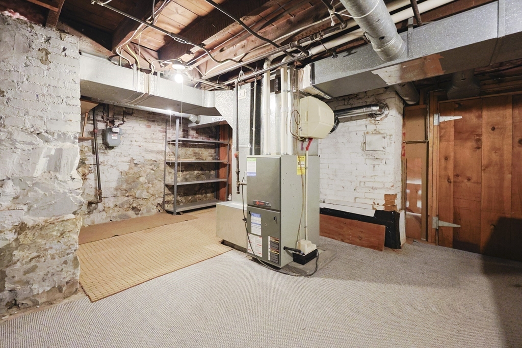580 2nd Street Everett, MA 02149 - Photo 26 of 29 a view of a room with wooden walls