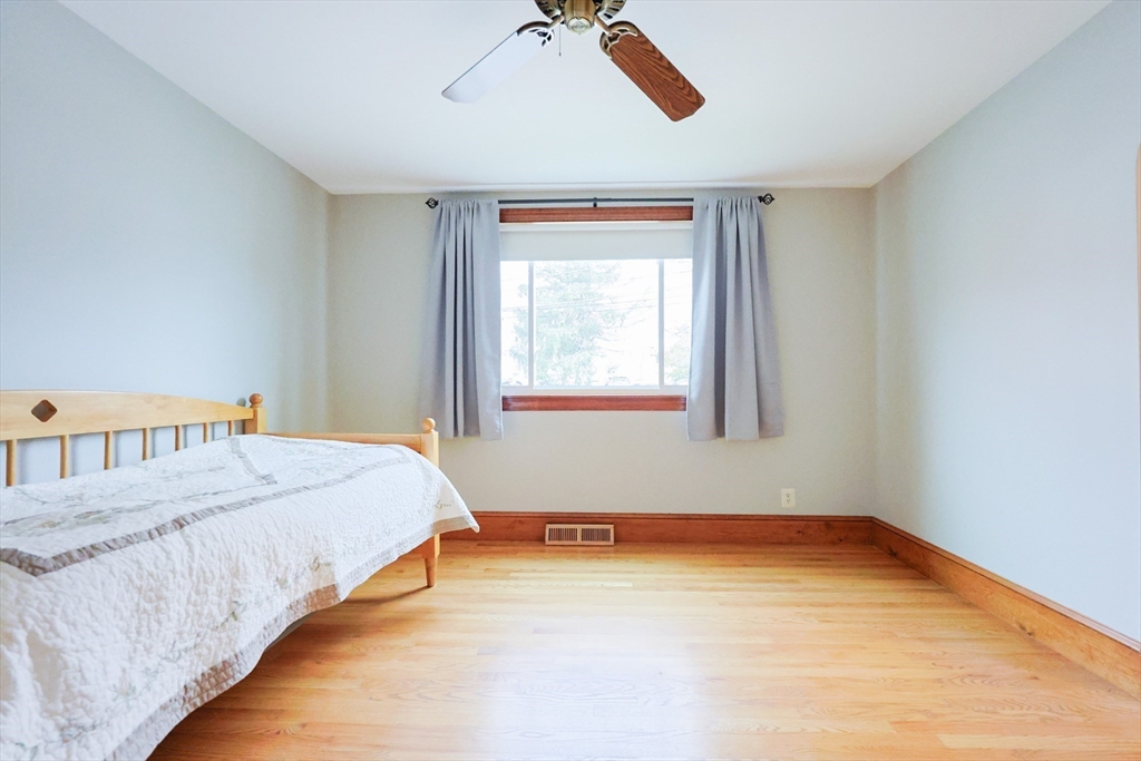 580 2nd Street Everett, MA 02149 - Photo 7 of 29 a bedroom with a bed and a window