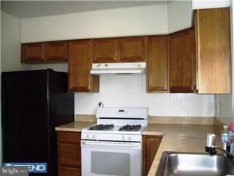 307 Margate Road Upper Darby, PA 19082 - Photo 4 of 10 a kitchen with a stove and a cabinets