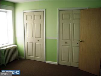 307 Margate Road Upper Darby, PA 19082 - Photo 7 of 10 an empty room with windows