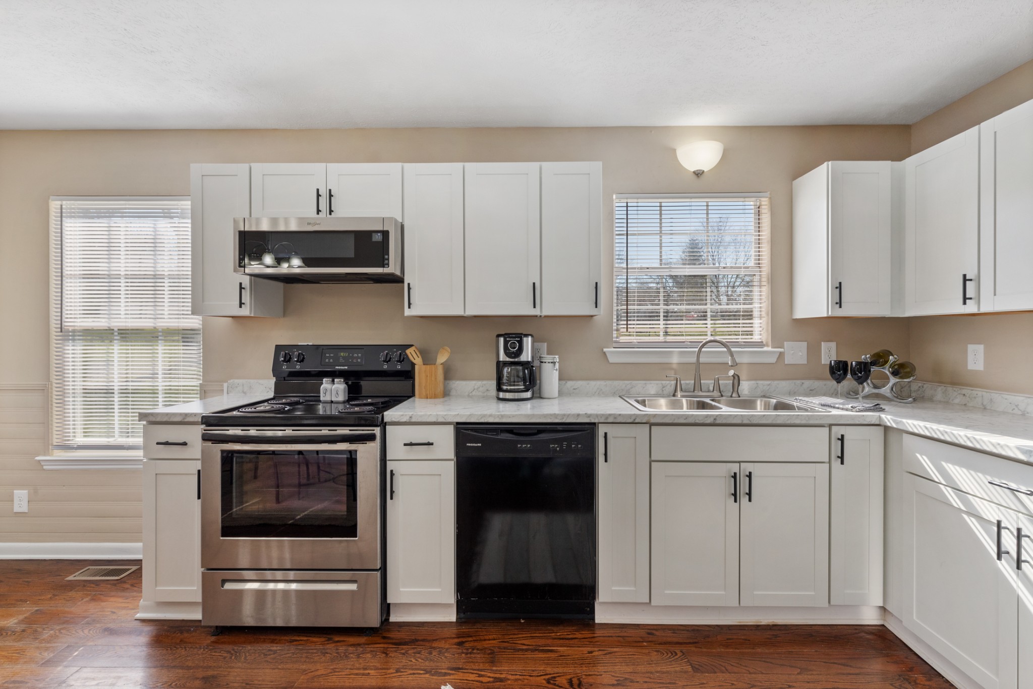 108 Aaron Drive Burns, TN 37029 - Photo 13 of 31 a kitchen with stainless steel appliances a stove a sink and a microwave