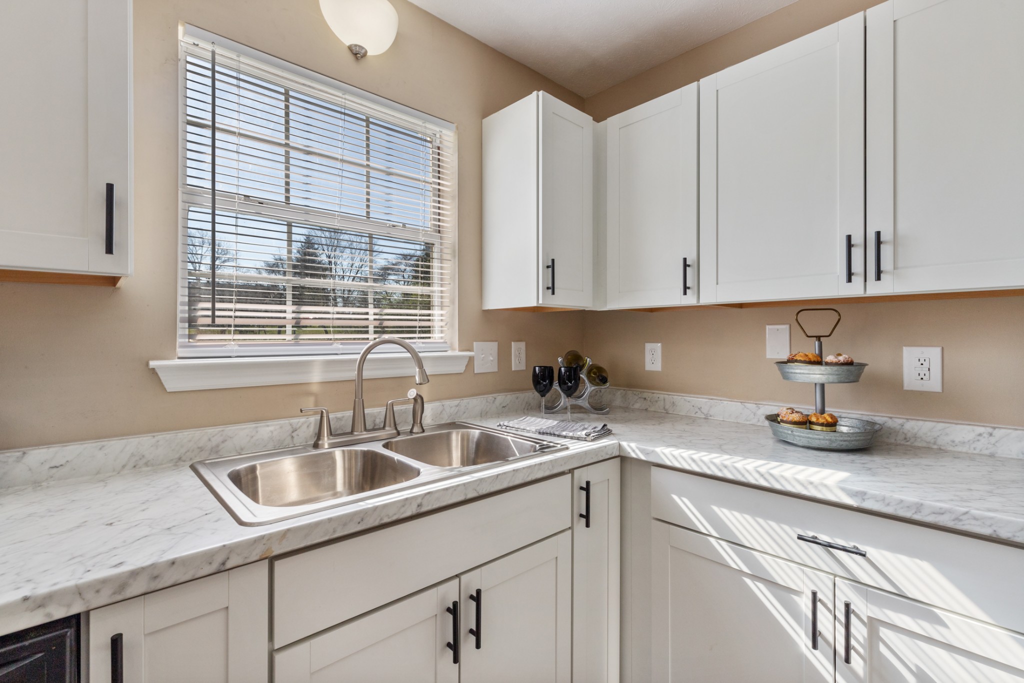 108 Aaron Drive Burns, TN 37029 - Photo 14 of 31 a kitchen with sink cabinets and window