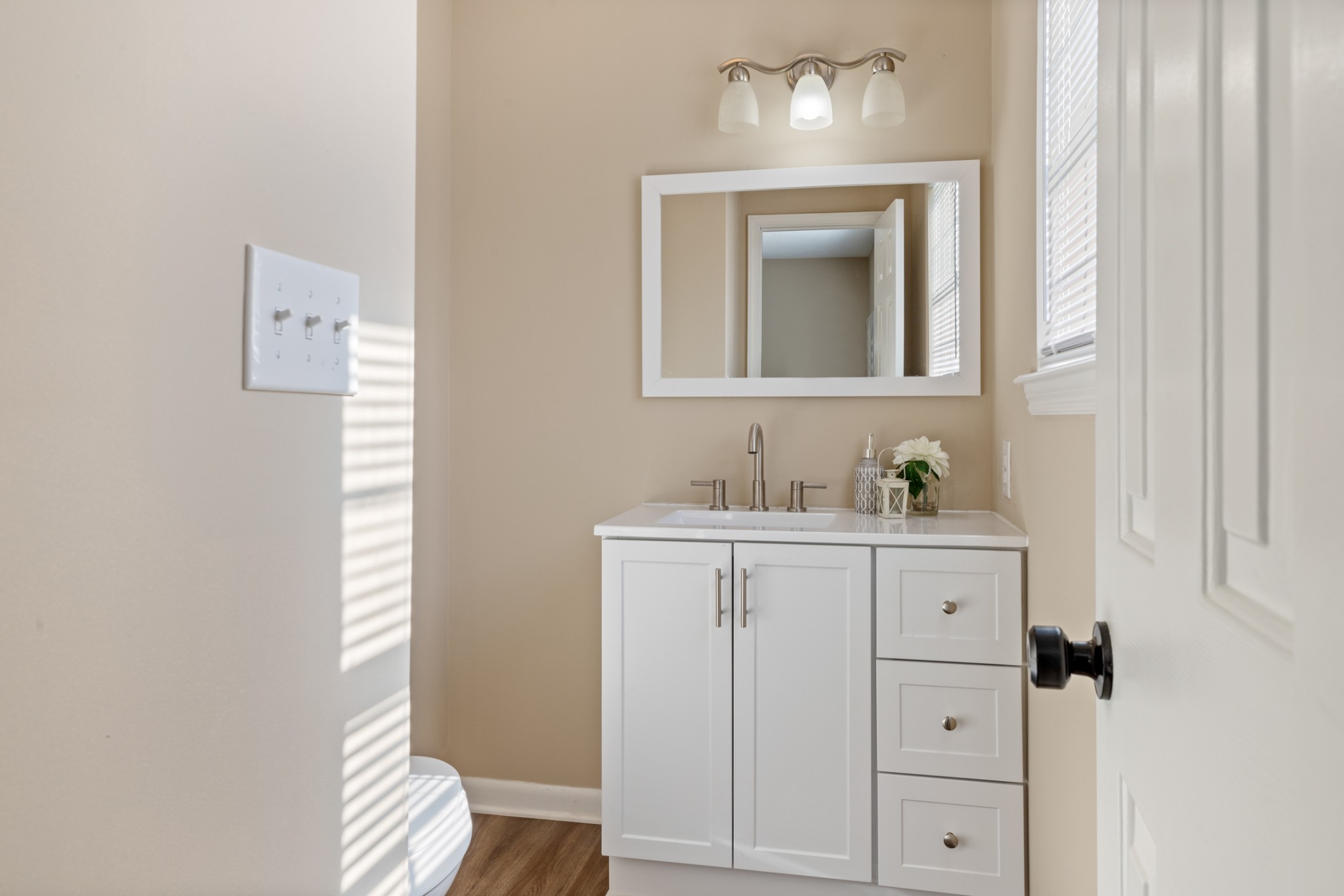 108 Aaron Drive Burns, TN 37029 - Photo 25 of 31 a bathroom with a sink a toilet and mirror