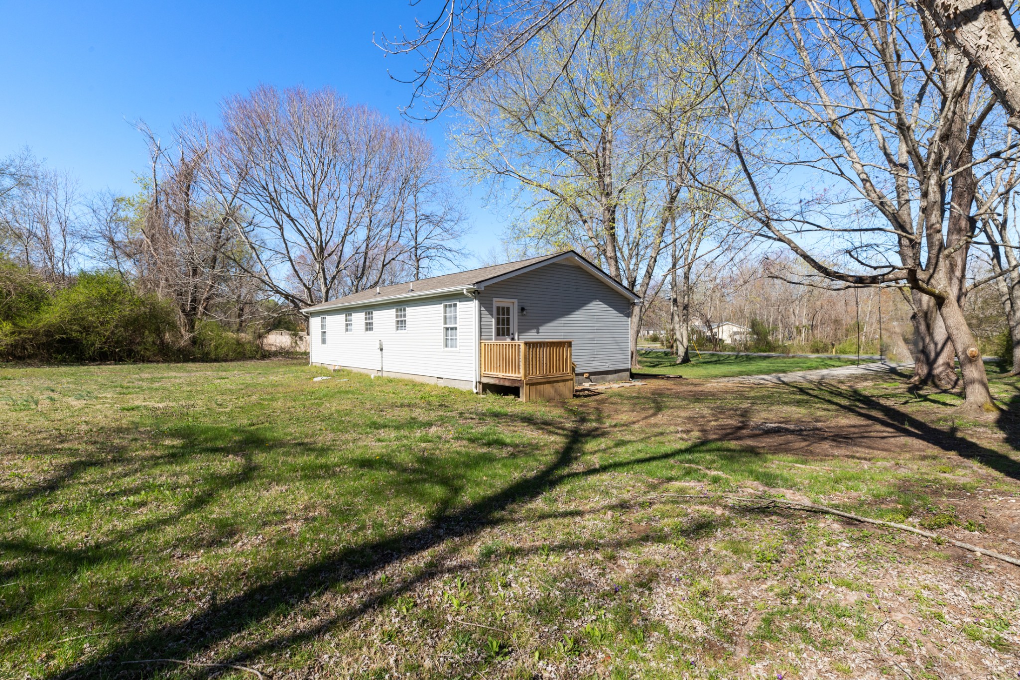 108 Aaron Drive Burns, TN 37029 - Photo 27 of 31 a view of a backyard with large trees