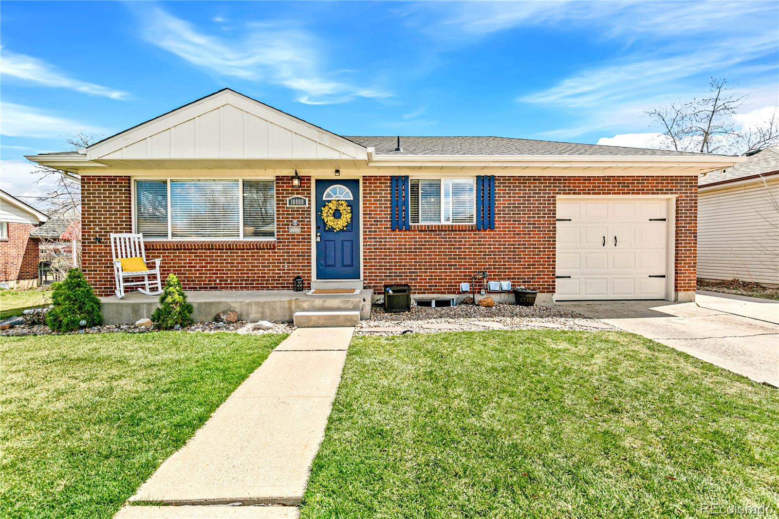 10800 Larry Drive Northglenn, CO 80233 - Photo 1 of 28 a front view of a house with a yard