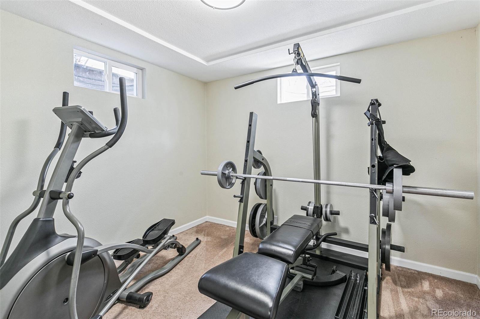10800 Larry Drive Northglenn, CO 80233 - Photo 21 of 28 a room with gym equipment