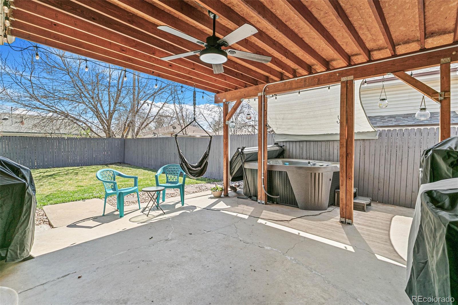 10800 Larry Drive Northglenn, CO 80233 - Photo 24 of 28 a view of a backyard with a patio and a garden