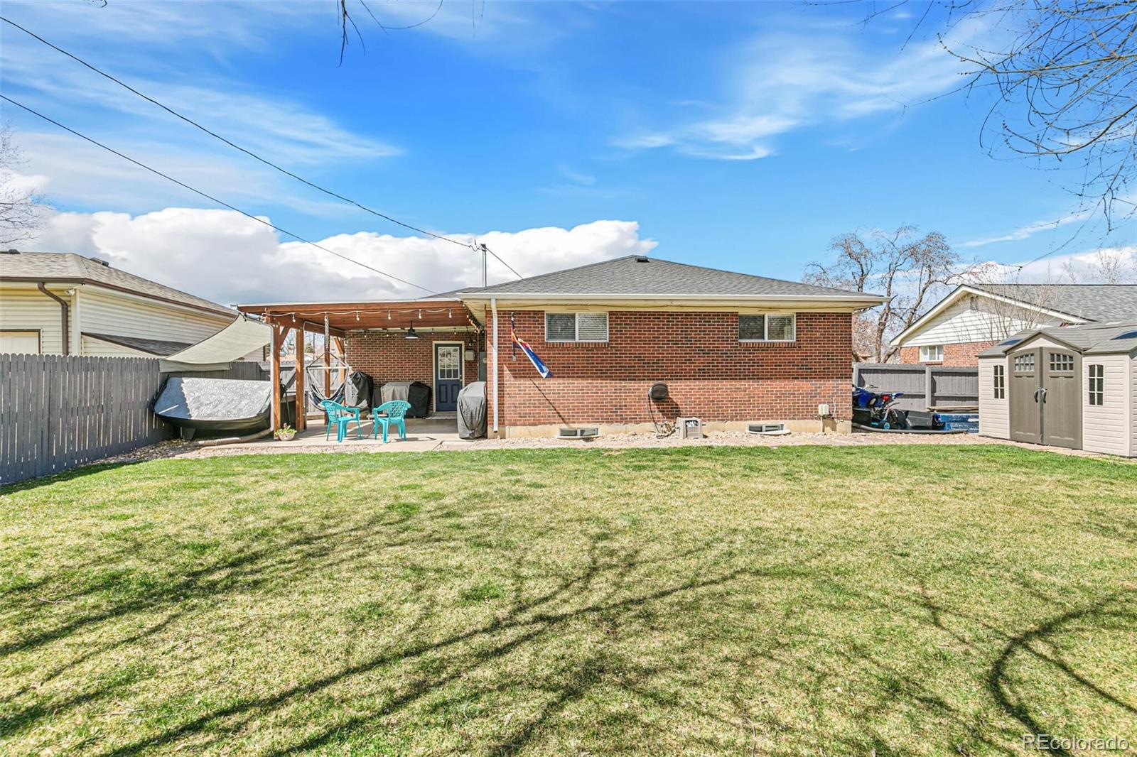 10800 Larry Drive Northglenn, CO 80233 - Photo 27 of 28 a front view of a house with garden