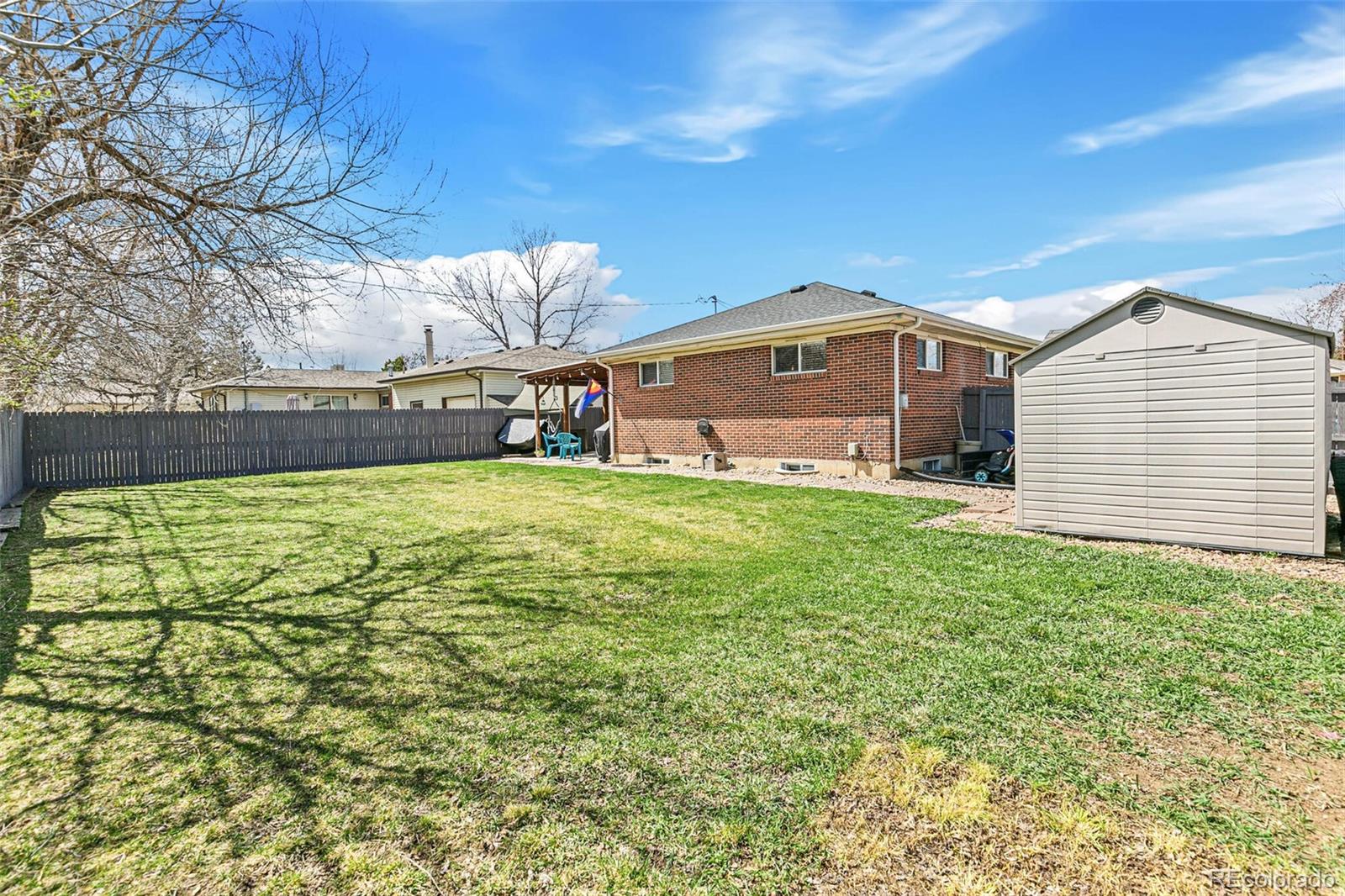 10800 Larry Drive Northglenn, CO 80233 - Photo 28 of 28 a front view of a house with a yard