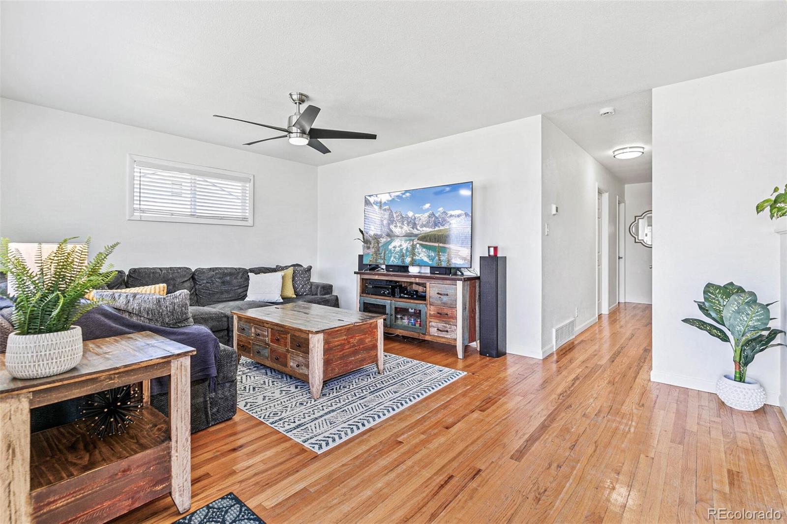 10800 Larry Drive Northglenn, CO 80233 - Photo 3 of 28 a living room with furniture and a fireplace