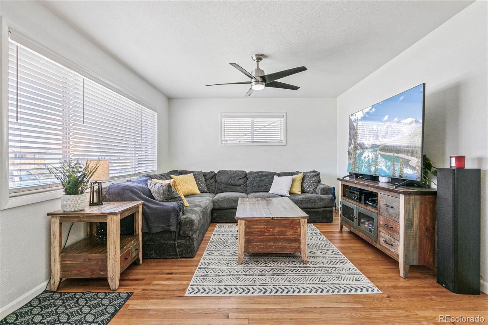 10800 Larry Drive Northglenn, CO 80233 - Photo 4 of 28 a living room with furniture a rug and a window