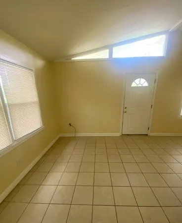 a view of an empty room and window