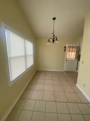 a view of an empty room and window