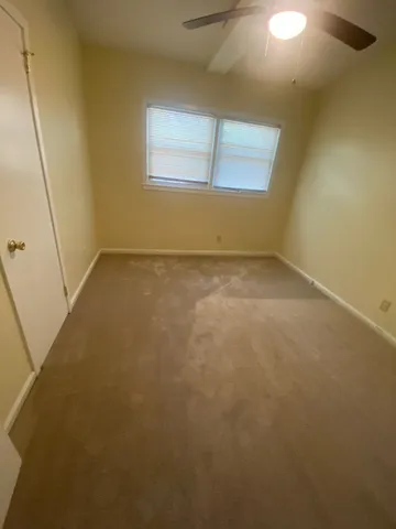 an empty room with a windows