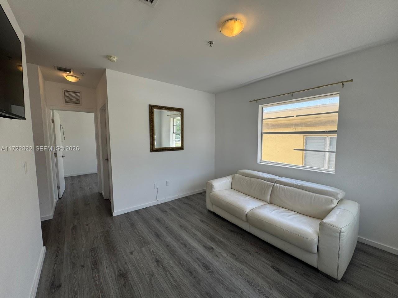 810 7th Street, Unit 207 Miami Beach, FL 33139 - Photo 7 of 16 a spacious bedroom with a couch and a couch