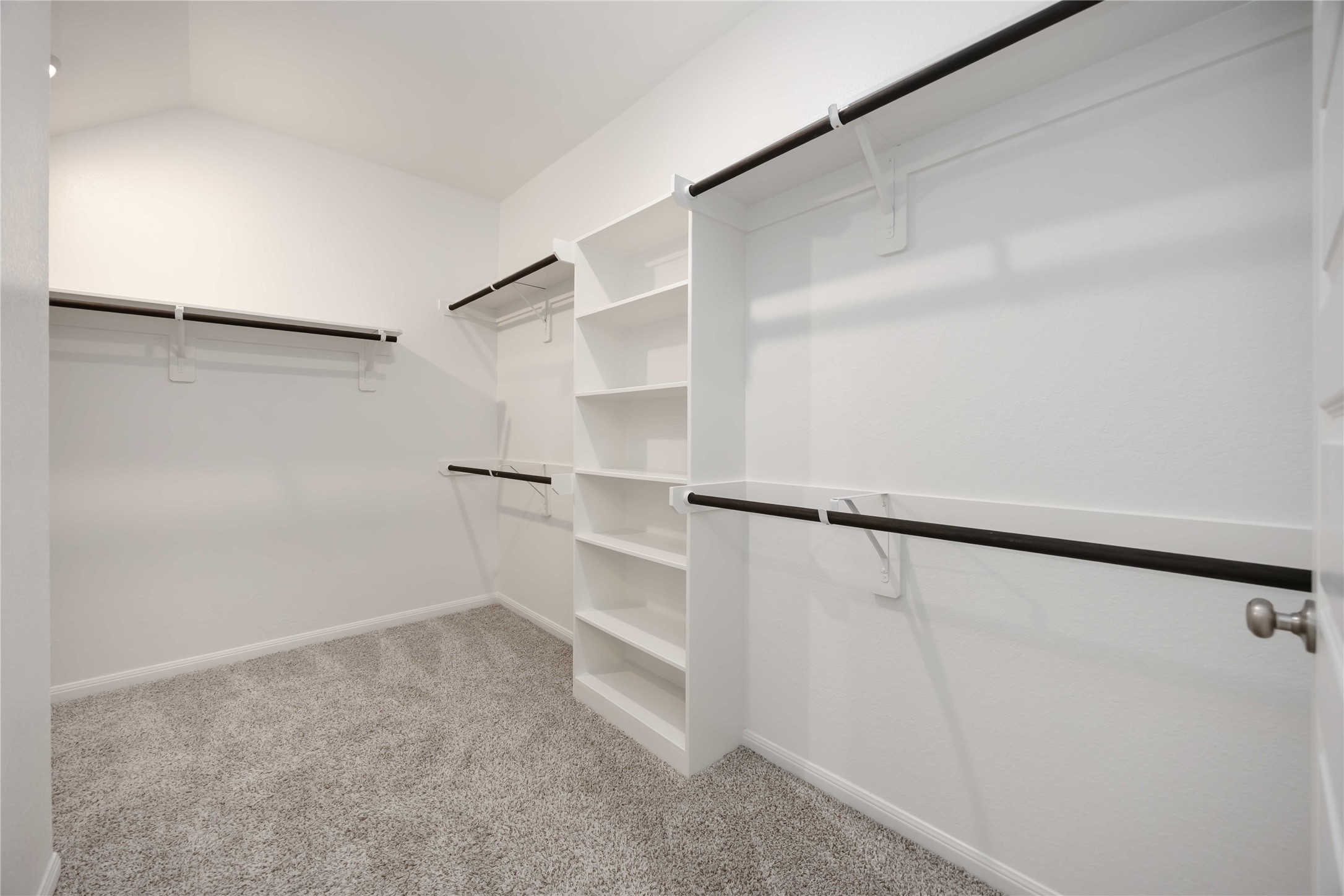 6814 Ventura Drive Rosharon, TX 77583 - Photo 17 of 30 The full-entry closet allows for easy and comfortable organization, with soft carpeting, built-in open shelving and hanging options, ready to house wardrobe essentials and more.
