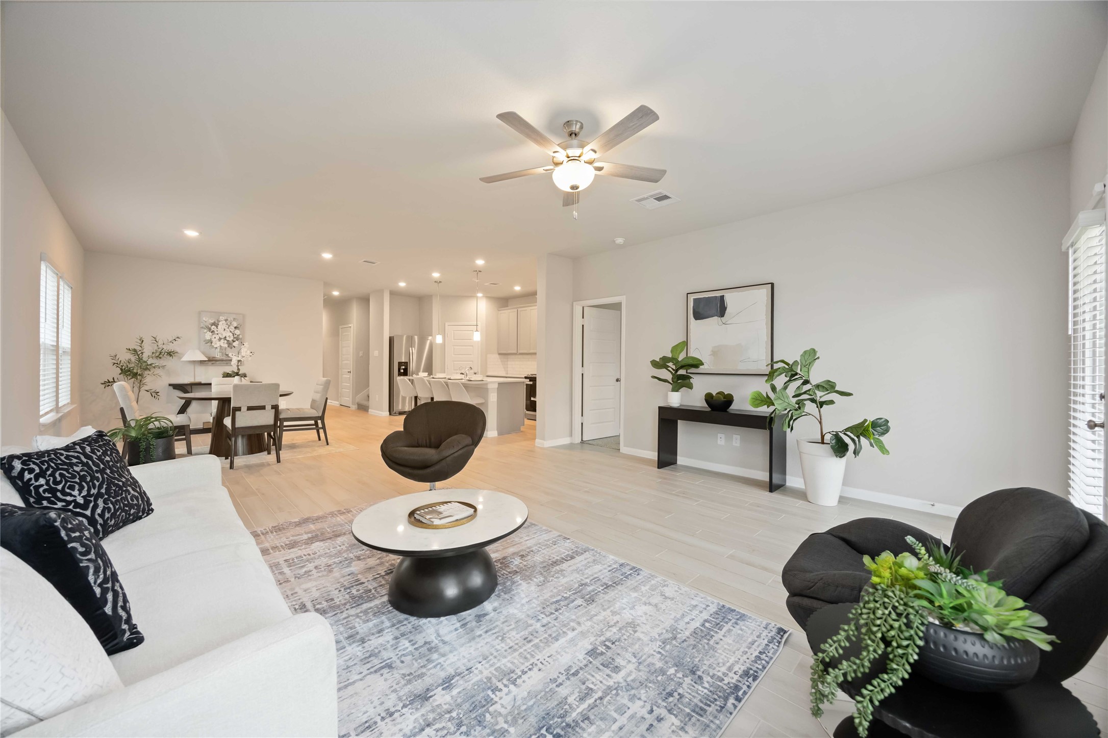 6814 Ventura Drive Rosharon, TX 77583 - Photo 2 of 30 The open-concept design effortlessly balances the living room, dining area, and kitchen, offering both flow and definition—each space distinct, yet in harmony.