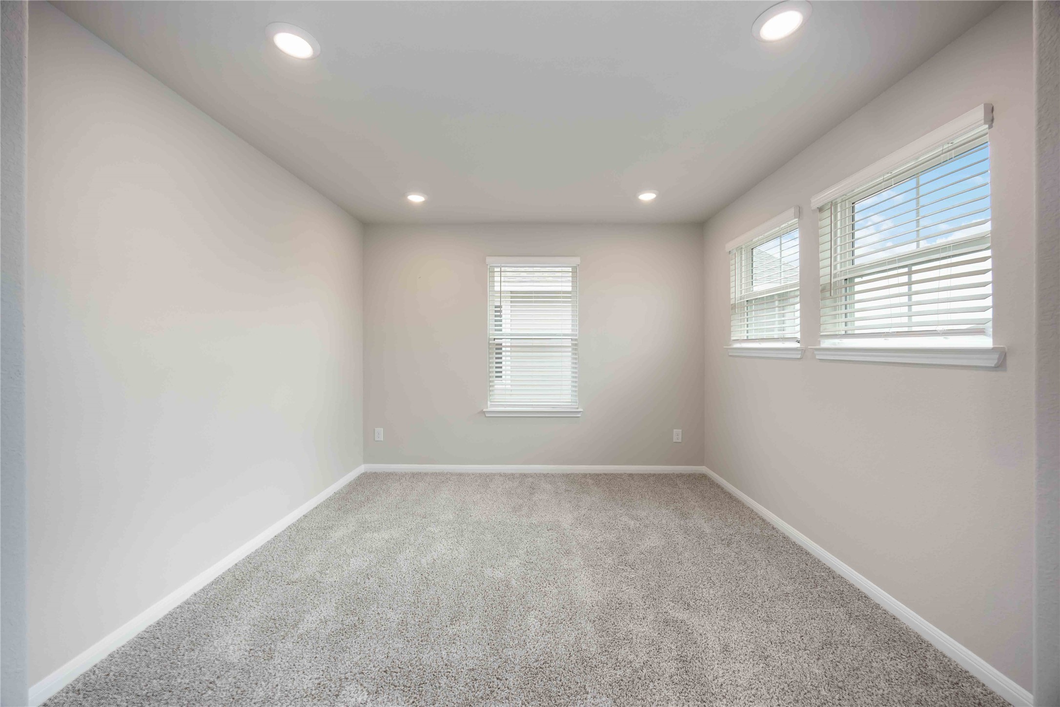 6814 Ventura Drive Rosharon, TX 77583 - Photo 21 of 30 Tucked beside the game room, the upstairs sitting area provides a flexible escape—bathed in light from wide windows, it’s ideal for study, lounging, or a play space.