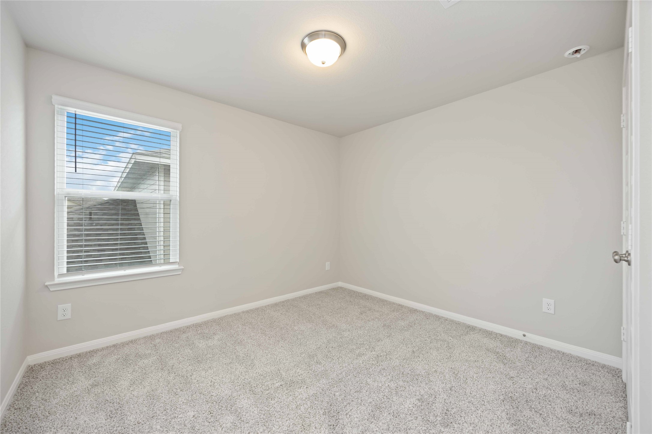 6814 Ventura Drive Rosharon, TX 77583 - Photo 22 of 30 Another restful bedroom awaits, echoing the home’s serene palette and plush textures, with a large window that brings in plenty of light.