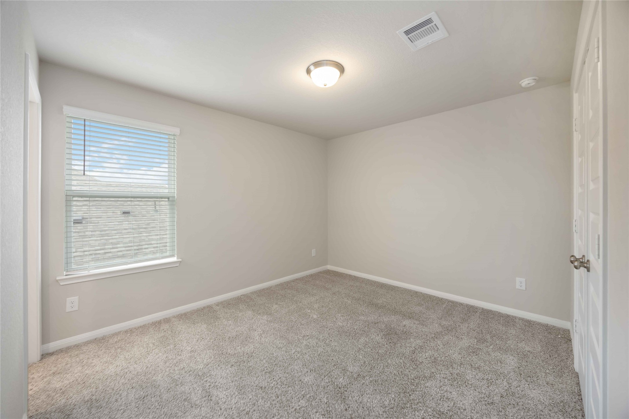 6814 Ventura Drive Rosharon, TX 77583 - Photo 25 of 30 Another tranquil retreat, this bedroom continues the soft neutral palette and carpeting, with ample natural light for an airy and open feel.