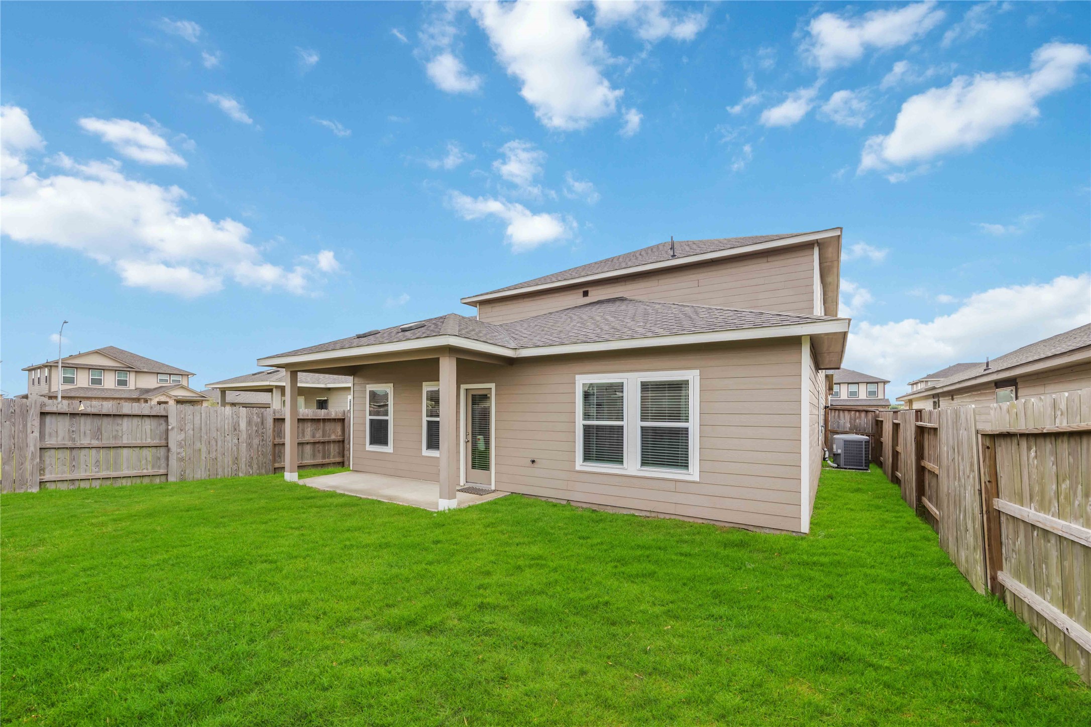 6814 Ventura Drive Rosharon, TX 77583 - Photo 30 of 30 The fully fenced backyard is a generous expanse of green—ready for outdoor gatherings, garden dreams, or a simple moment of calm under open skies.