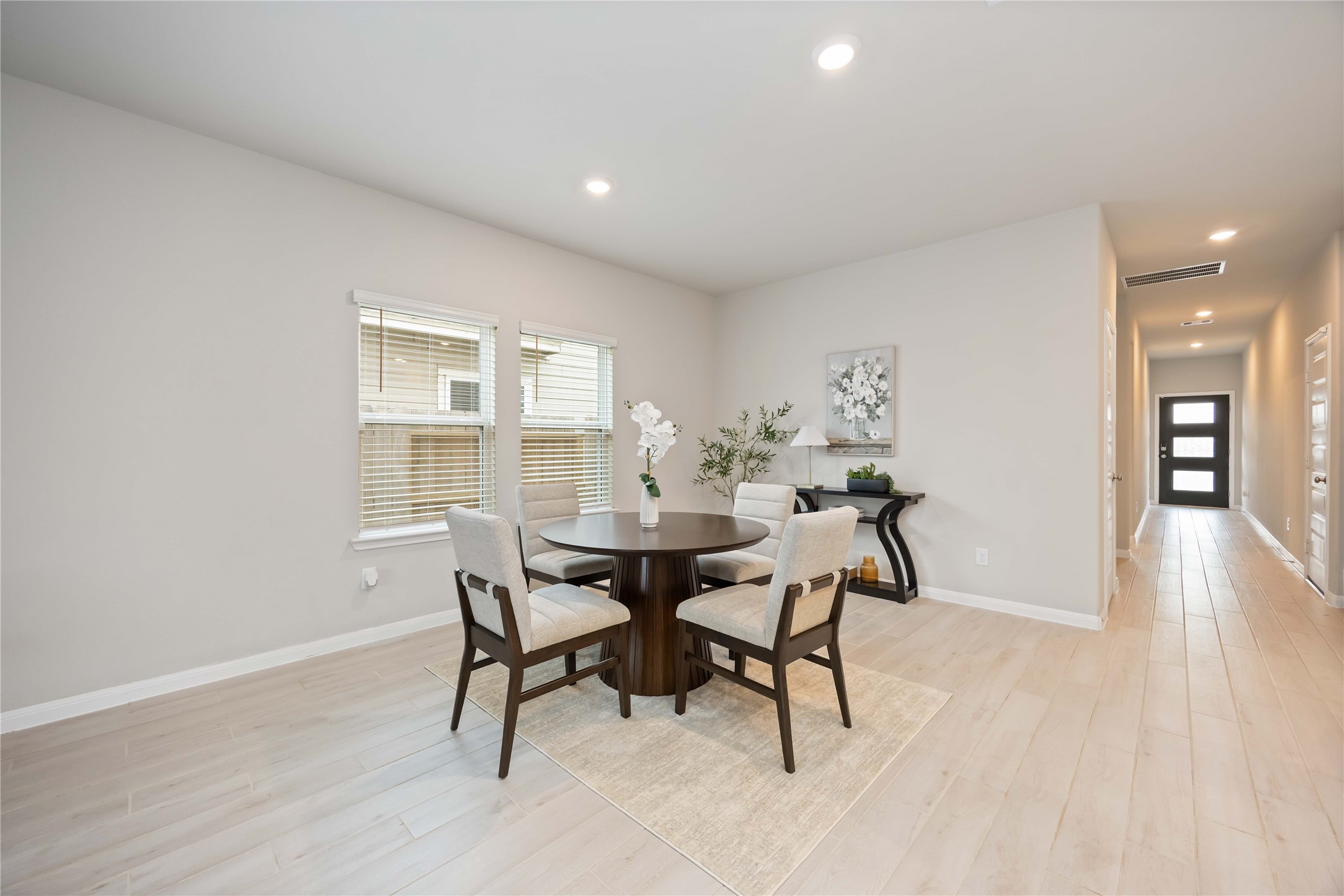 6814 Ventura Drive Rosharon, TX 77583 - Photo 8 of 30 The dining area feels airy and open, with large windows that fill the space with daylight. Whether it’s everyday meals or special gatherings, this corner invites lingering conversations and relaxed moments.