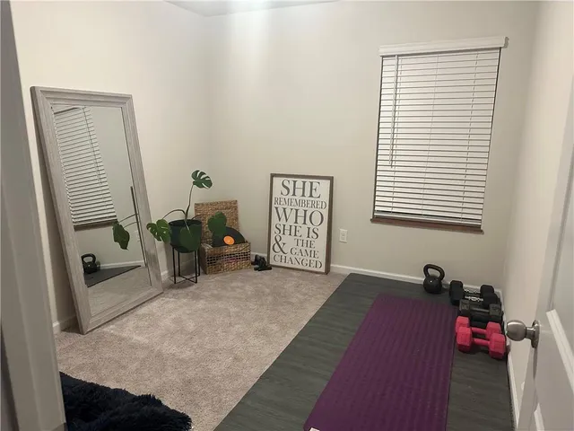 a bed room with a bed and a window