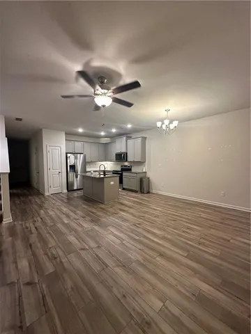 a view of a room with a kitchen