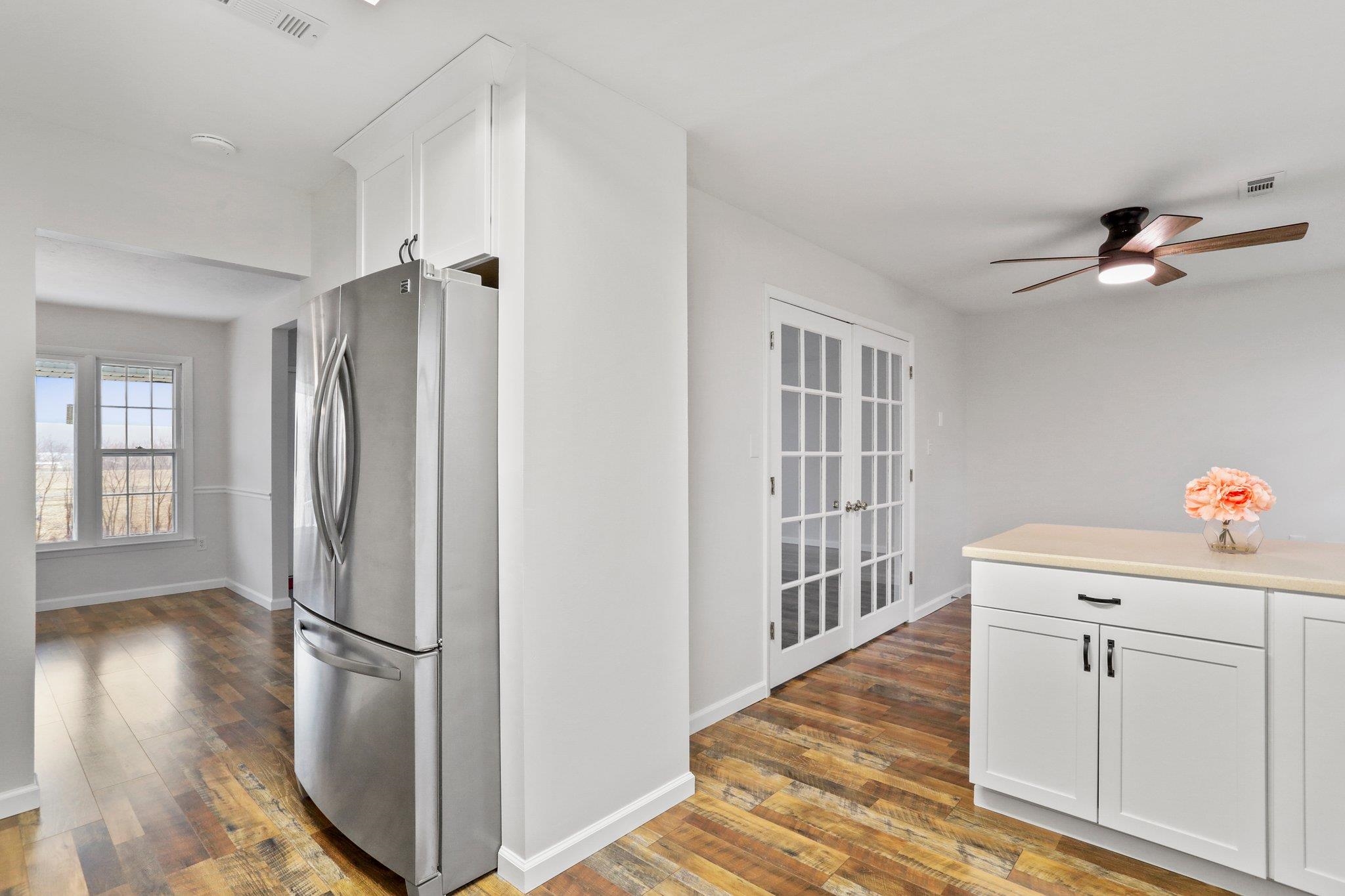 18196 New Market Road Timberville, VA 22853 - Photo 13 of 34 a kitchen with a refrigerator a sink and cabinets