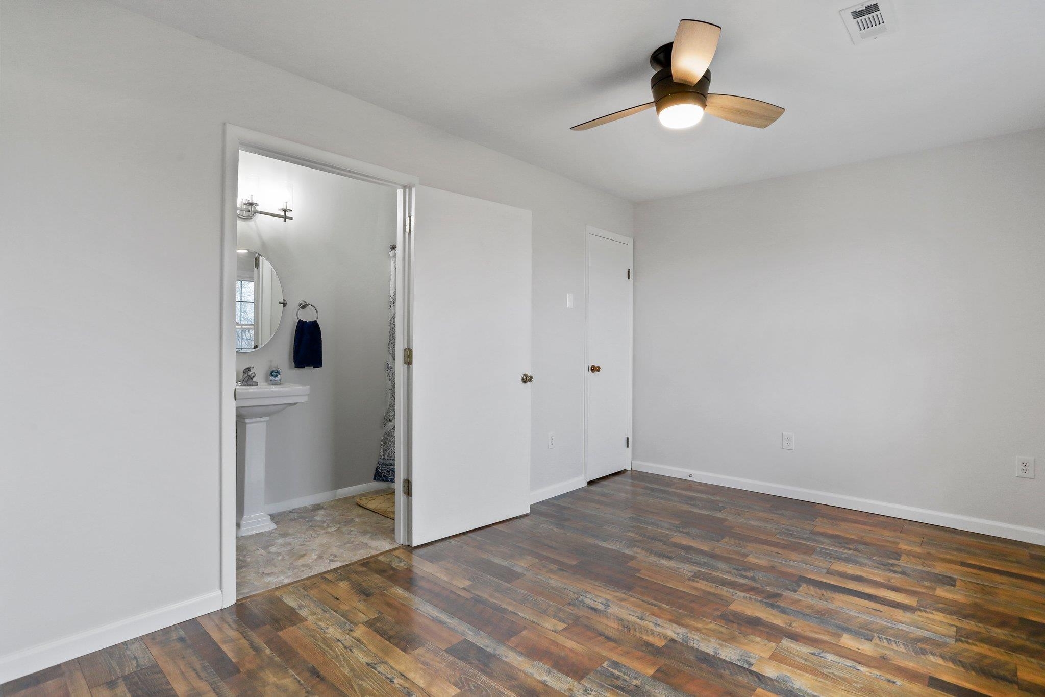 18196 New Market Road Timberville, VA 22853 - Photo 19 of 34 a view of an empty room and window and wooden floor