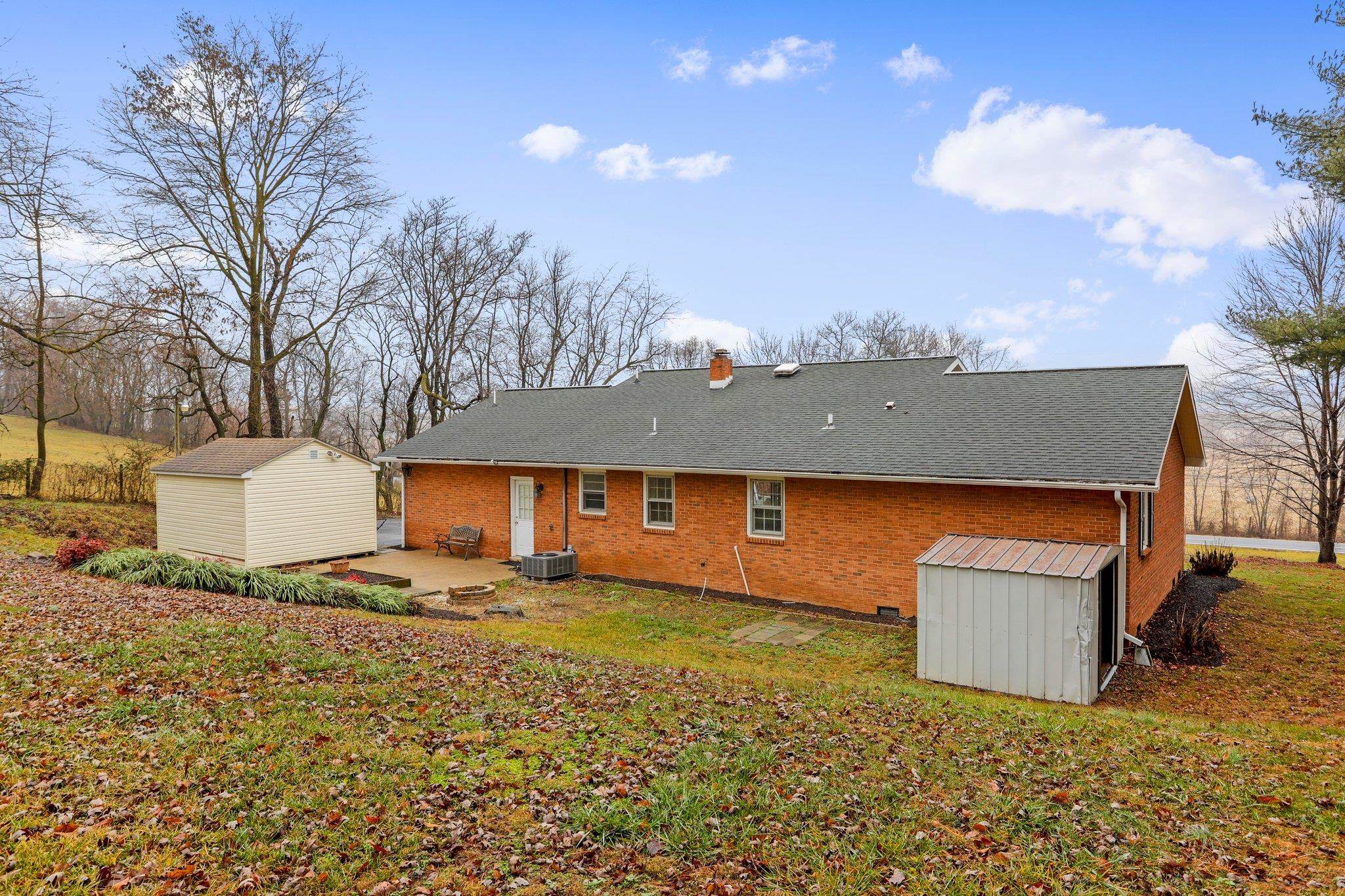 18196 New Market Road Timberville, VA 22853 - Photo 26 of 34 a view of a house with a yard