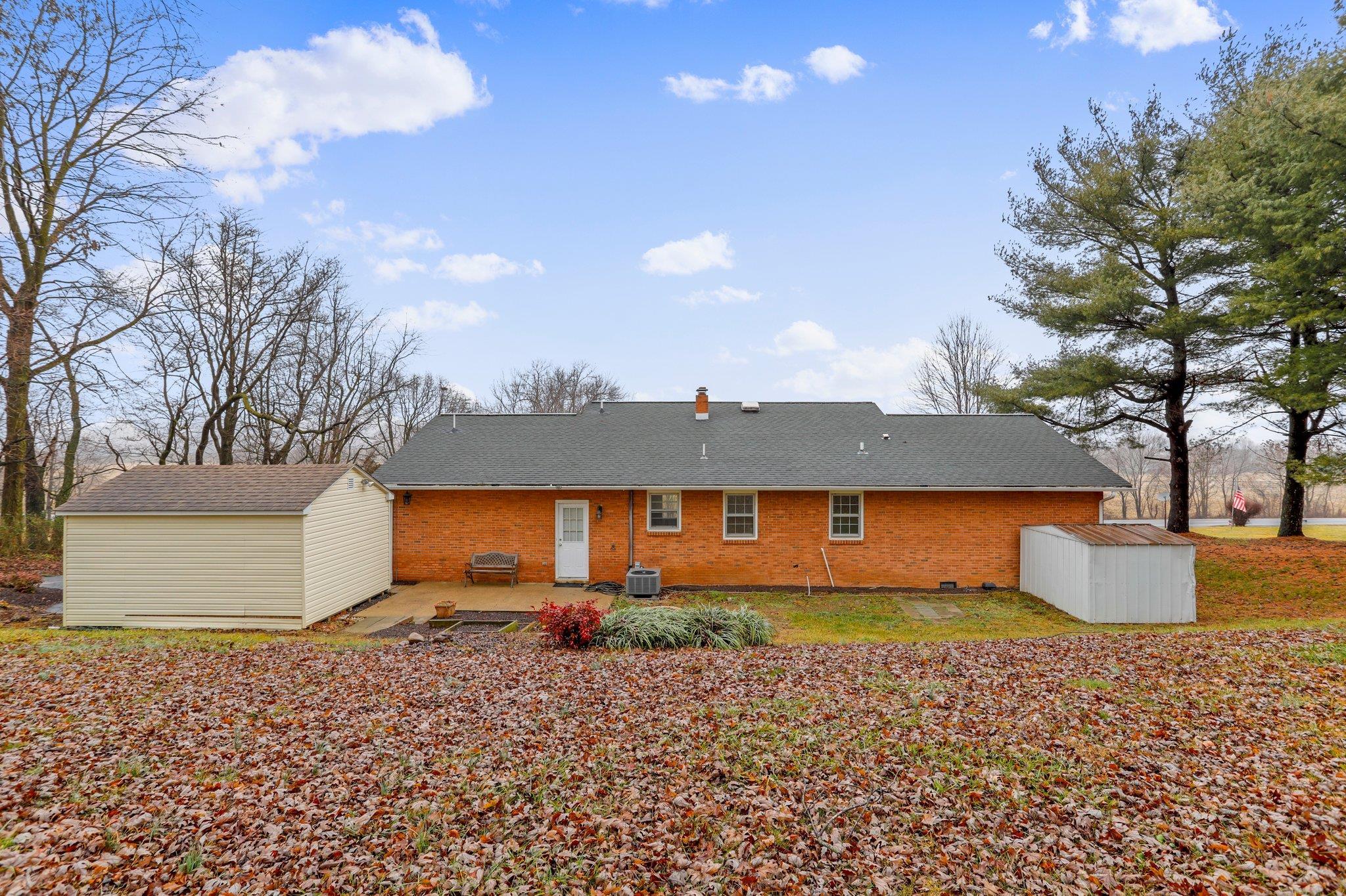 18196 New Market Road Timberville, VA 22853 - Photo 27 of 34 a front view of a house with a yard and garage