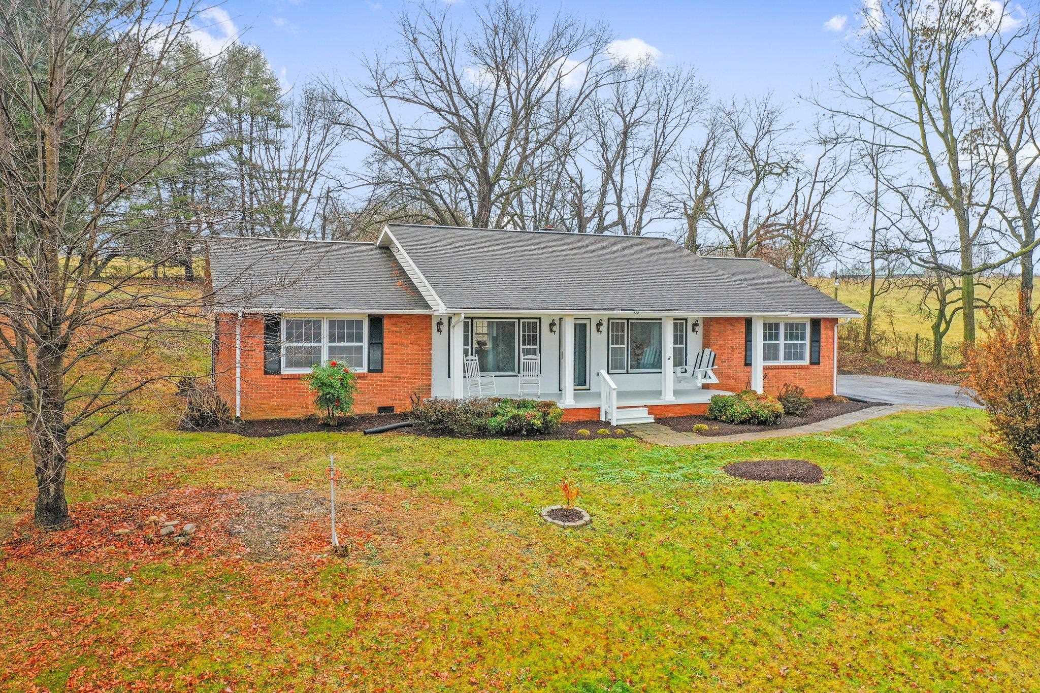 18196 New Market Road Timberville, VA 22853 - Photo 30 of 34 a front view of a house with swimming pool having outdoor seating