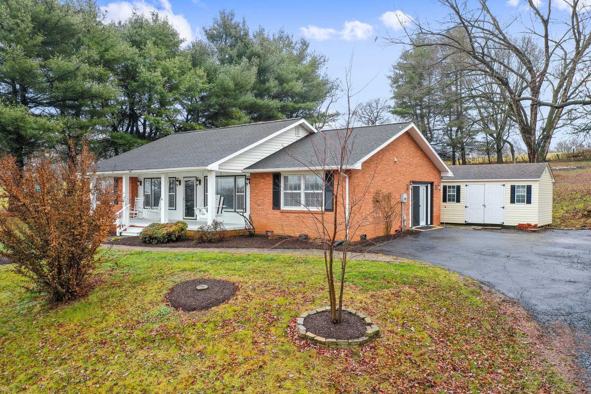 18196 New Market Road Timberville, VA 22853 - Photo 32 of 34 a front view of a house with a yard