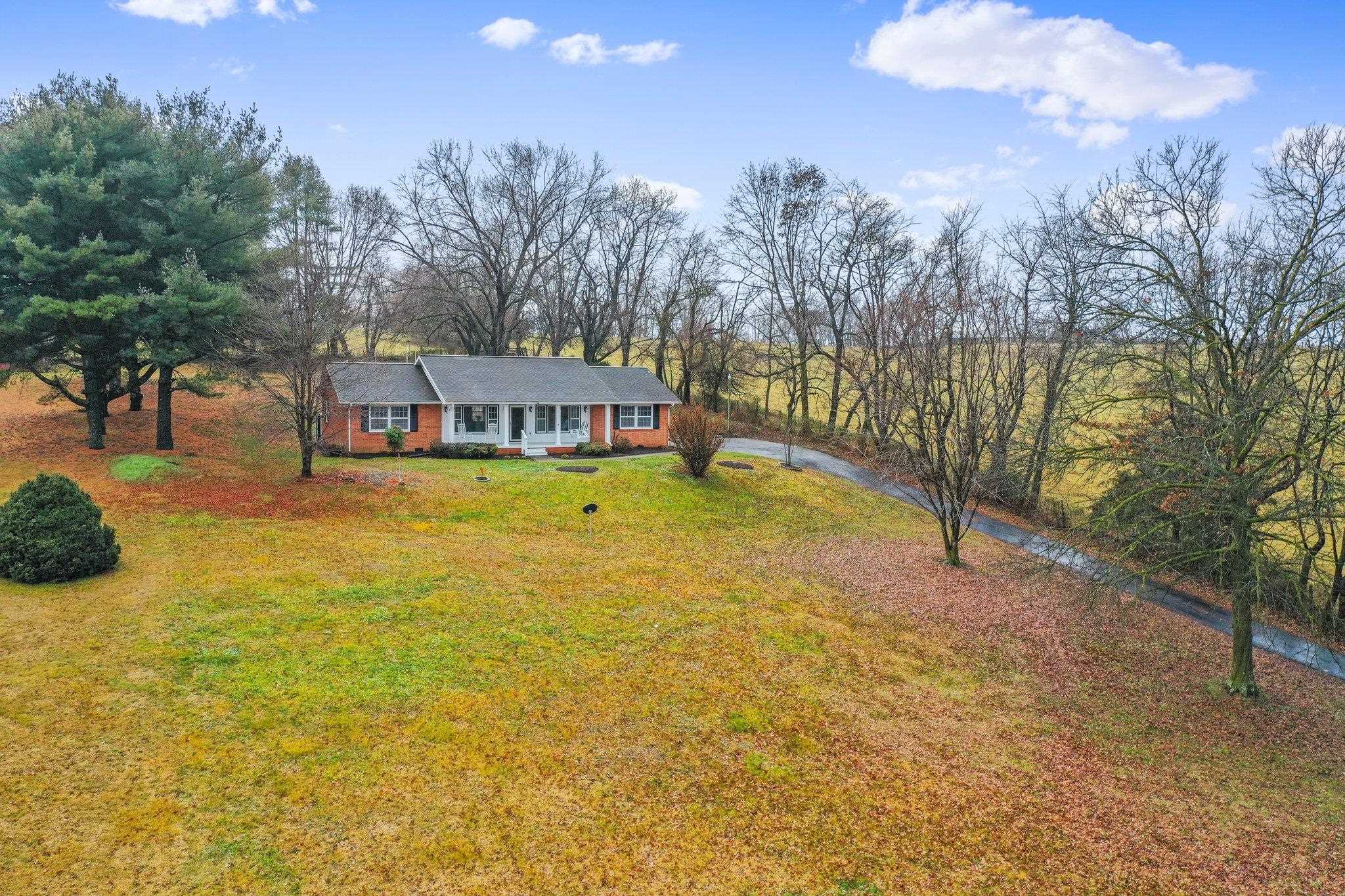 18196 New Market Road Timberville, VA 22853 - Photo 33 of 34 a view of a lake with houses in the back