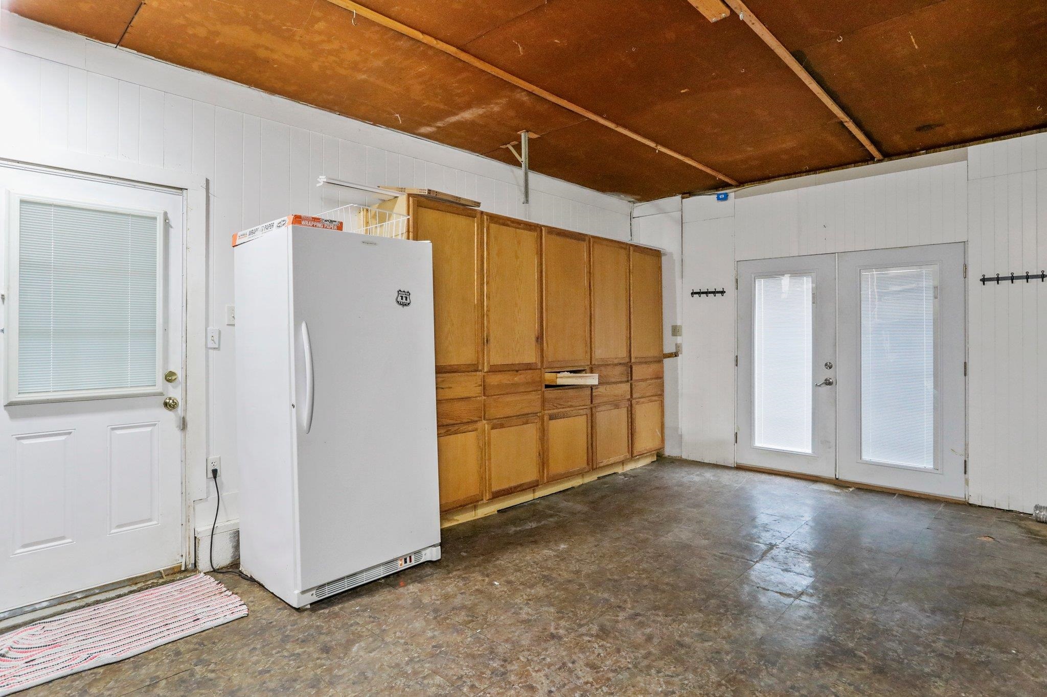 18196 New Market Road Timberville, VA 22853 - Photo 34 of 34 a view of a refrigerator in kitchen and an empty room
