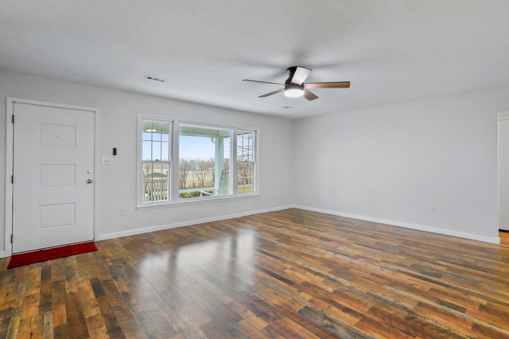 18196 New Market Road Timberville, VA 22853 - Photo 6 of 34 wooden floor in an empty room with a window