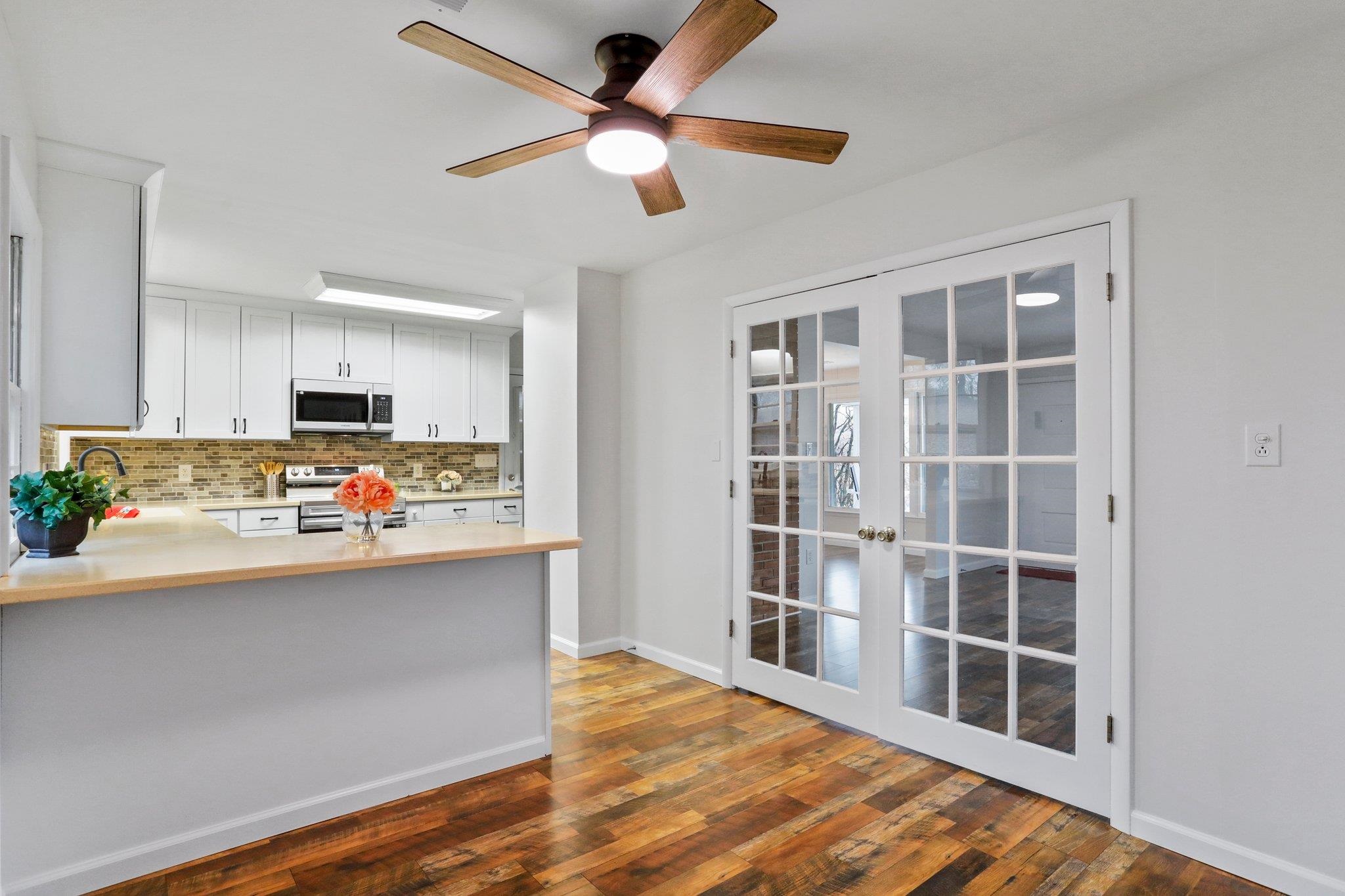 18196 New Market Road Timberville, VA 22853 - Photo 7 of 34 a view of kitchen with furniture and wooden floor