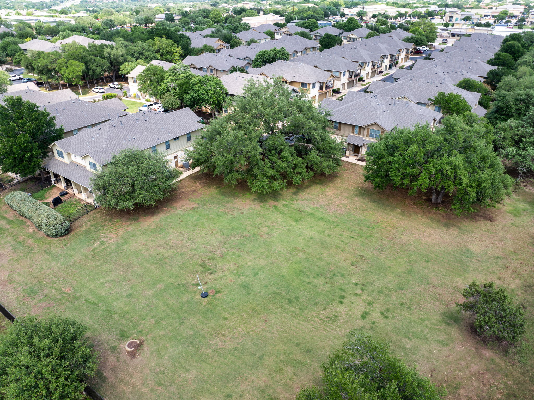 14815 Avery Ranch Boulevard, Unit 1401 Austin, TX 78717 - Photo 22 of 38 Expansive green space featuring mature trees and a residential backdrop