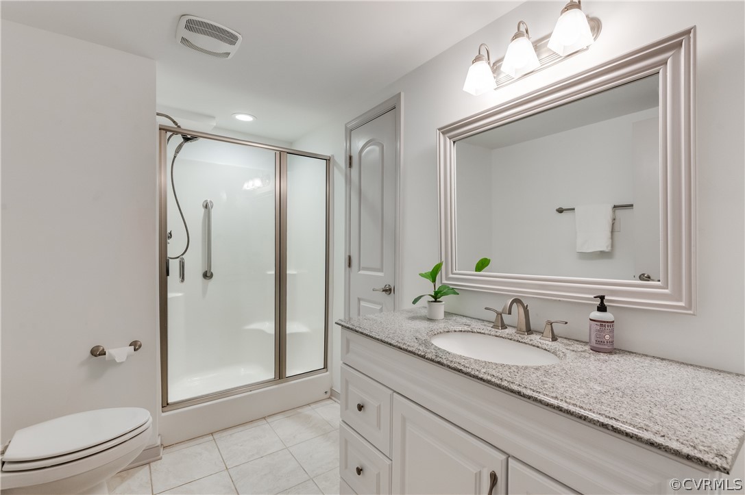 3720 Cheyenne Road Richmond, VA 23235 - Photo 41 of 49 a bathroom with a granite countertop sink toilet and shower
