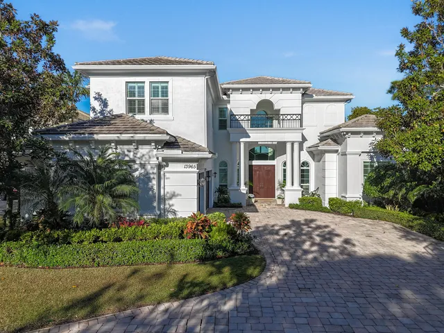 a view of a lake with a house in the background