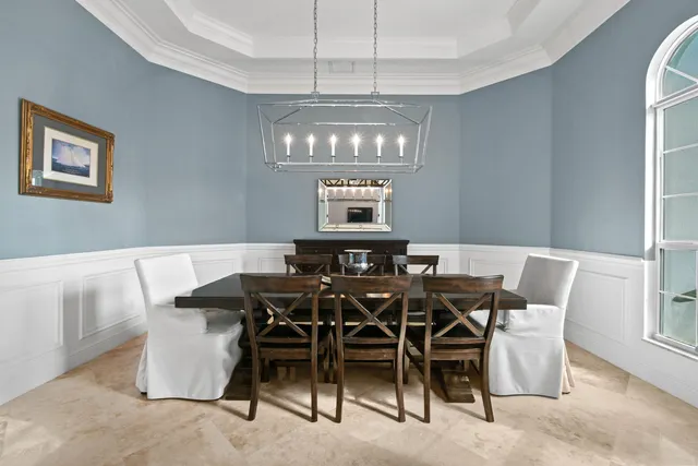 a spacious bedroom with a large bed and a flat screen tv