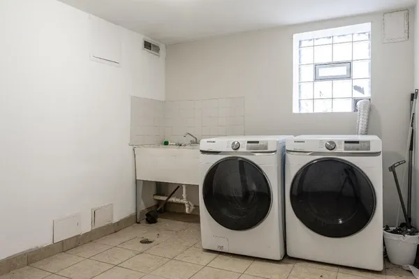 a utility room with dryer and washer